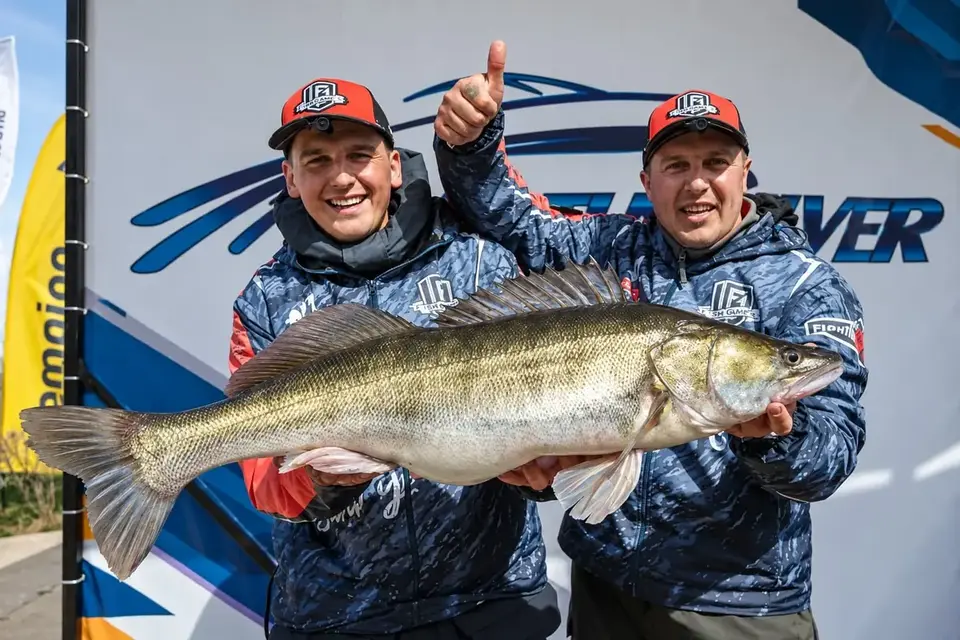 Anglers holding a catch after a fishing session